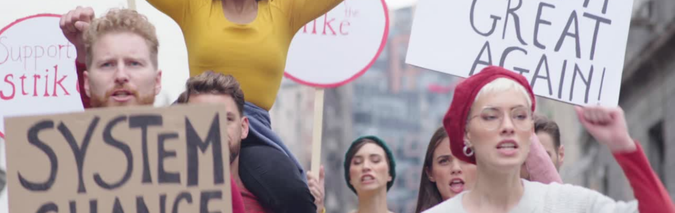 People marching with signs to support climate change action