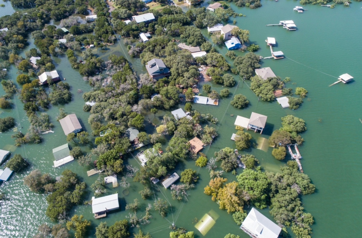 Homes in a Texas neighborhood are submerged in water.