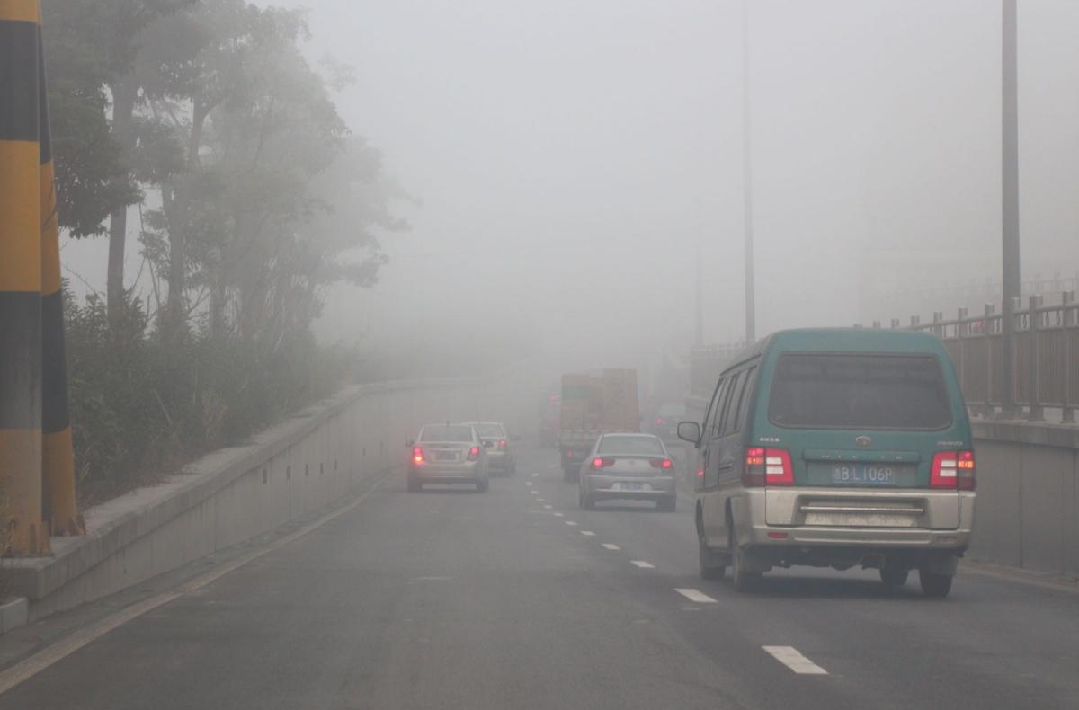 Traffic passes through polluted air in Ningbo, China.