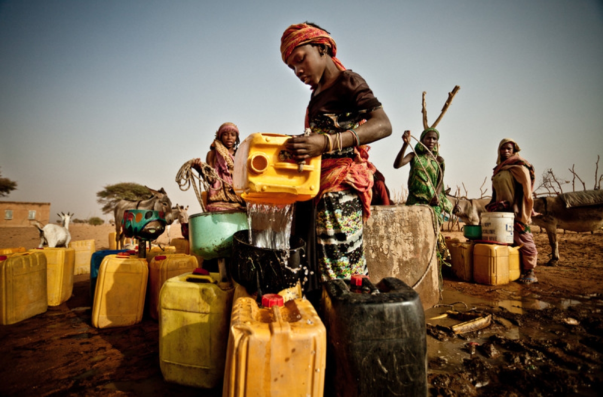 Boy pouring water