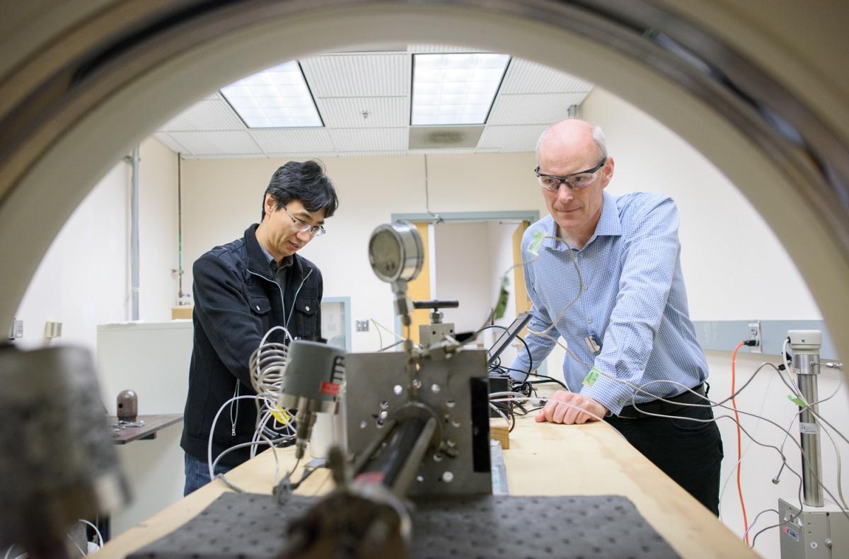 researchers working with CT scanner