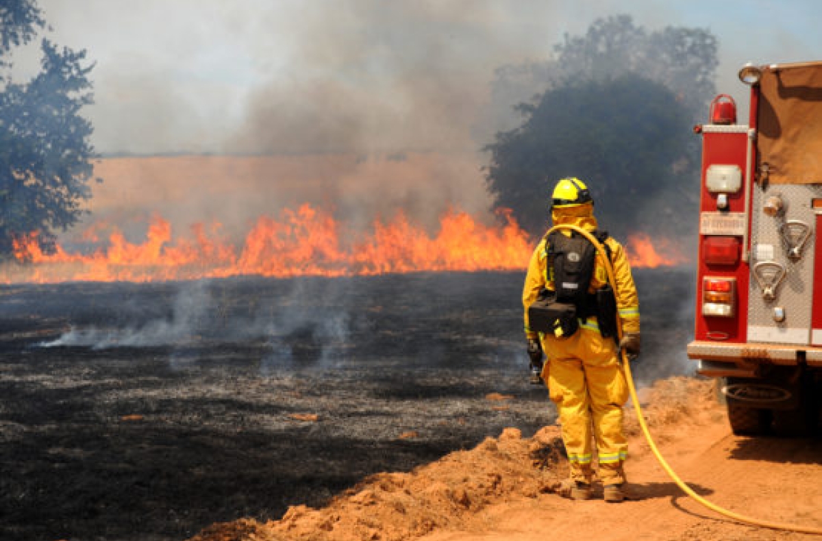 Firefighter monitors prescribed burn