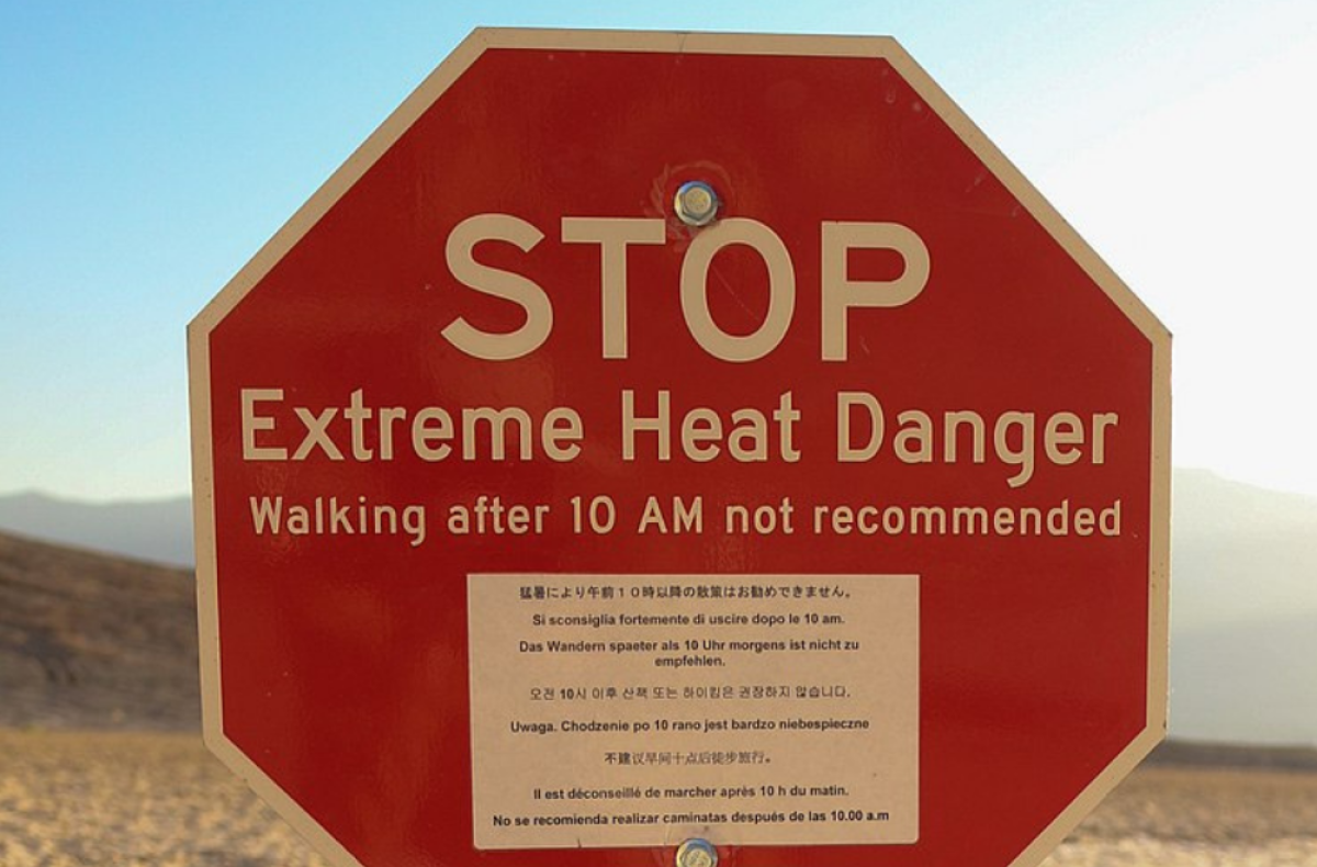 stop sign with warning of extreme heat 