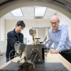 researchers working with CT scanner