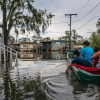 A New Orleans family travels to their home near New Orleans, La., after it was flooded during Hurricane Ida on September 13, 2021. 
