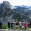 Hikers admire half dome in Yosemite