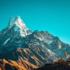 Machapuchare snowcapped peak in the Himalaya mountains, Nepal, which reaches over 20,000 feet in elevation. 