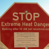 stop sign with warning of extreme heat 