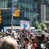 protest with a sign that reads save the planet