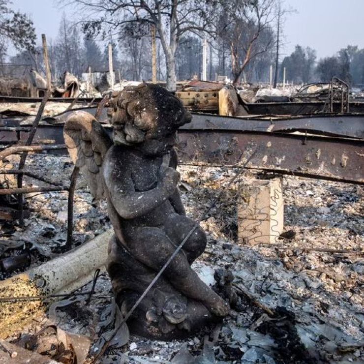 A charred statue sits among the destruction at Coleman Creek Estates mobile home park in Phoenix, Ore., Thursday, Sept. 10, 2020. The area was destroyed when a wildfire swept through on Tuesday, Sept. 8. A trial in connection with a $1.6 billion class action lawsuit against utility PacifiCorp over the catastrophic Labor Day 2020 wildfires in Oregon wrapped up last week.