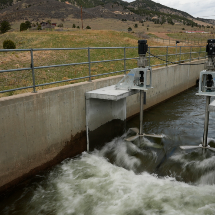 Water flows through an irrigation canal with a turbine at Ralston Reservoir in Arvada Colo. on Thursday, April 13, 2023.