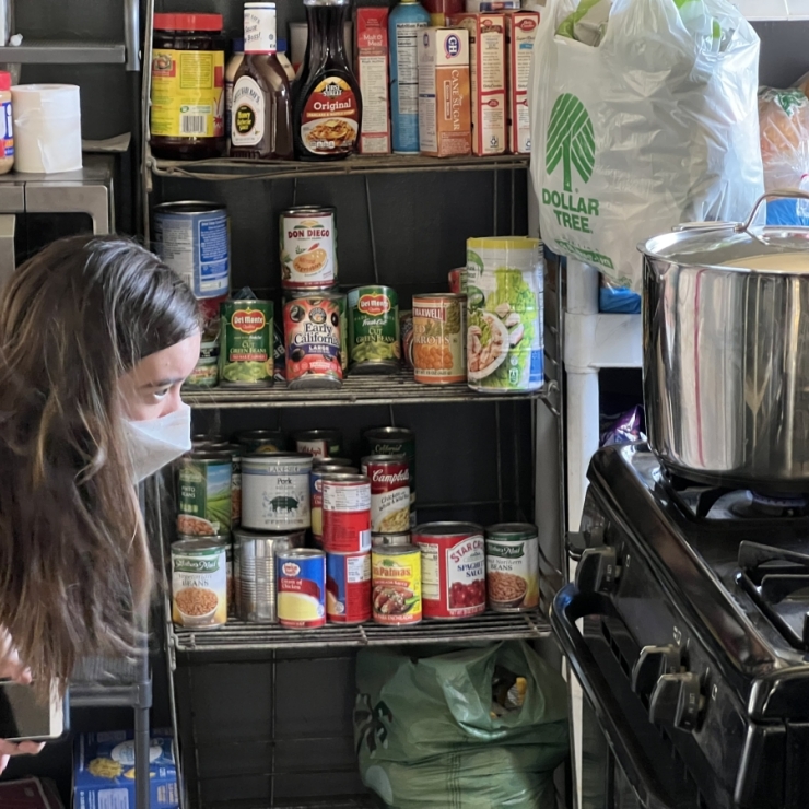 Stanford graduate student Metta Nicholson preparing to test a gas stove in Bakersfield, Calif.