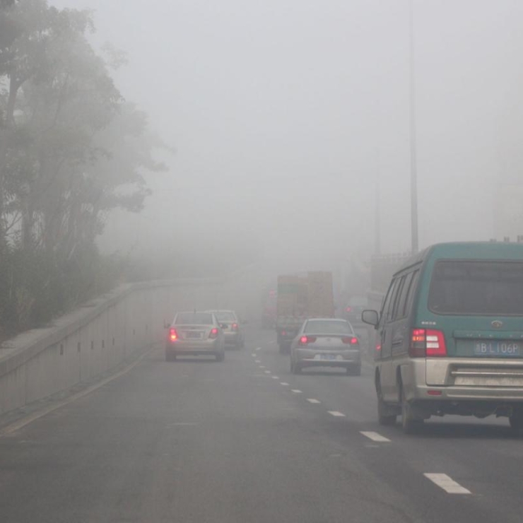 Traffic passes through polluted air in Ningbo, China.