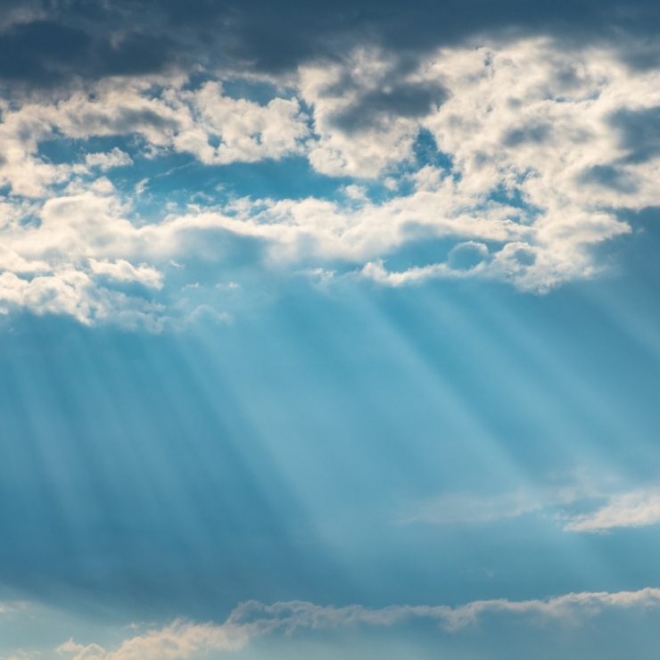 Sunlight streams through clouds