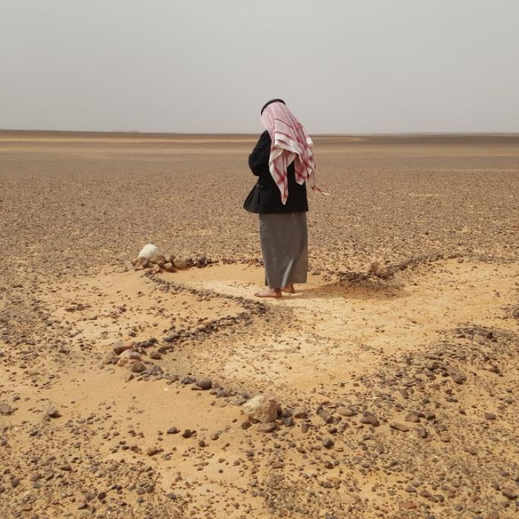 A Bedouin man prays in arid eastern Jordan.