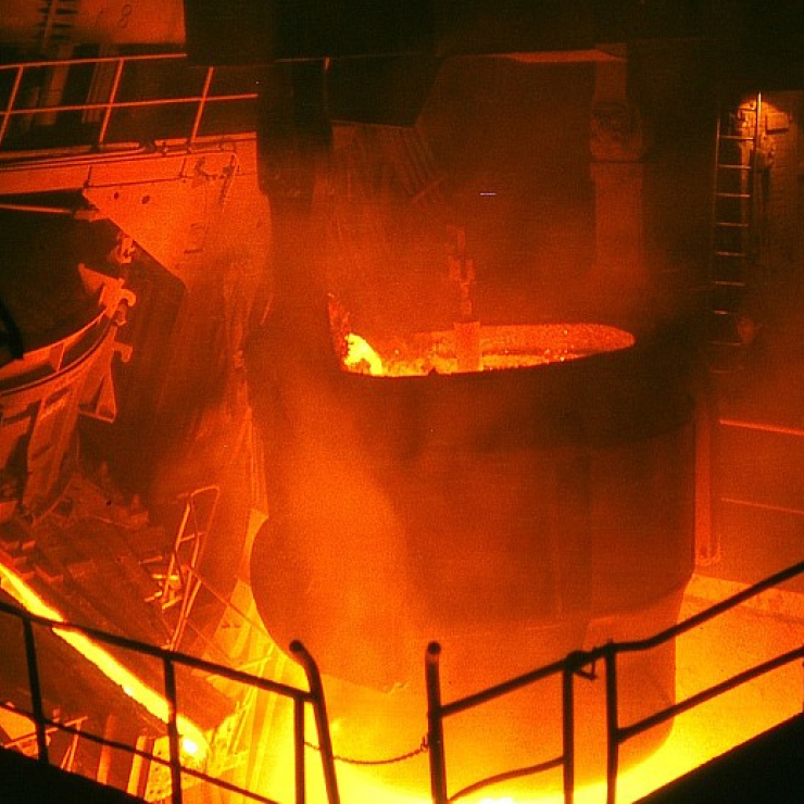 Iron smelting; a large pot over a high heat fire 