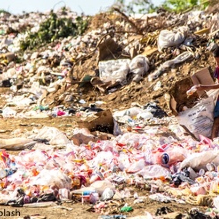 A child sorts through plastic trash in Nicaragua.